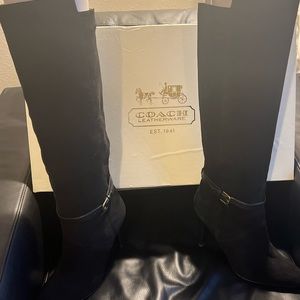 Coach tall suede high heel boots with boot belt accent.